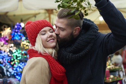couple kissing under the mistletoe