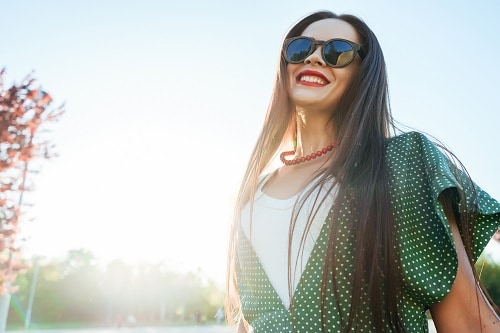 woman smiling in the sunshine